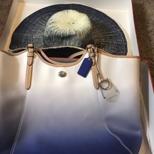 Coach purse and a hat